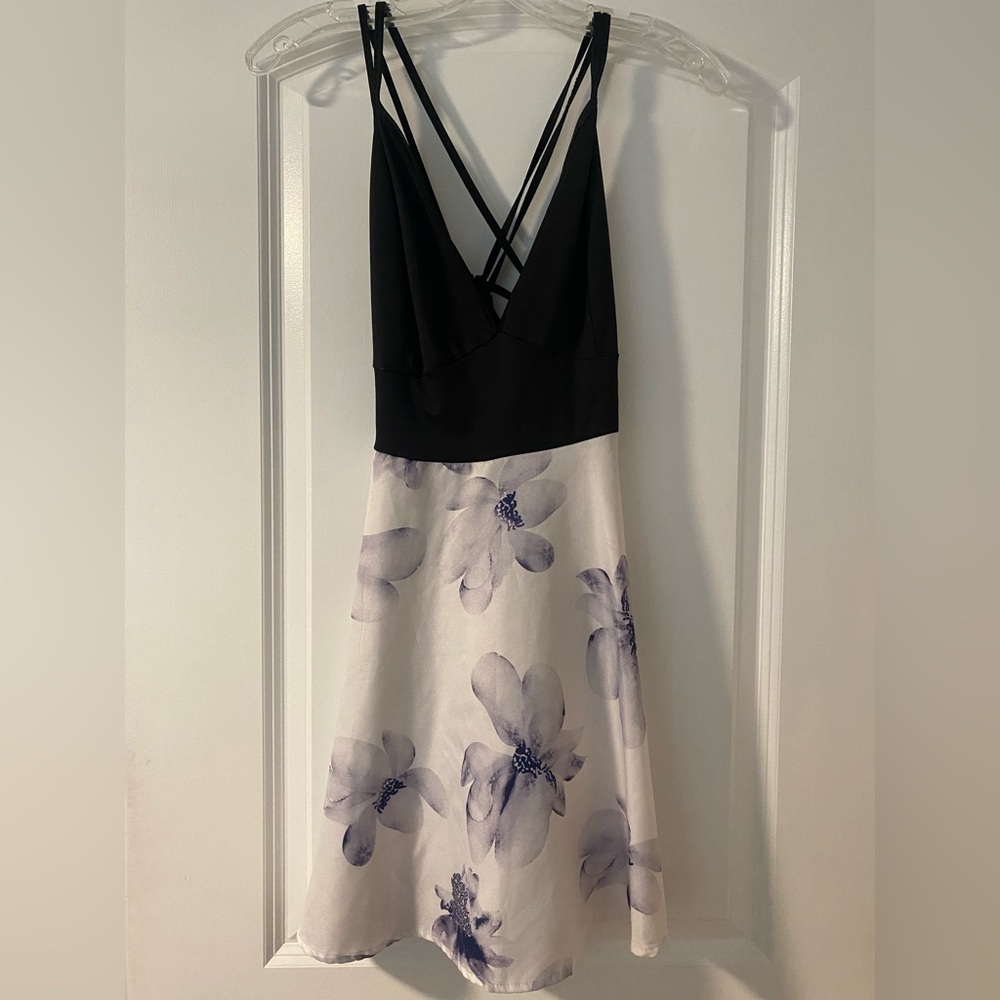 Black top and white bottom with purple flowers